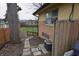 View of backyard of home showcasing a stone walkway, mature trees, and ample green space at 1936 Cunningham Rd, Indianapolis, IN 46224