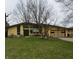 Charming single-story home with a lush front lawn and welcoming curb appeal at 1936 Cunningham Rd, Indianapolis, IN 46224