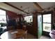 Kitchen featuring wood cabinets, red countertops, breakfast nook, and plenty of plants at 1936 Cunningham Rd, Indianapolis, IN 46224