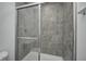 Modern bathroom showing tiled shower with glass doors at 1952 White Oak Ln, Shelbyville, IN 46176
