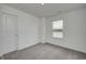 Bright bedroom with plush carpeting and a scenic outdoor view at 1952 White Oak Ln, Shelbyville, IN 46176