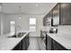 Bright, modern kitchen with stainless steel appliances, dark wood cabinets, and marble countertops at 1952 White Oak Ln, Shelbyville, IN 46176