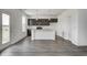 Stylish kitchen with gray cabinets, stainless appliances, pendant lights, and a central island at 1952 White Oak Ln, Shelbyville, IN 46176