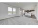 Open-concept living room features eat in kitchen, carpet, and large windows at 1952 White Oak Ln, Shelbyville, IN 46176