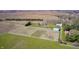 Property featuring large fenced pastures, outbuildings, and an appealing home with great curb appeal at 2009 W 250 N, Lebanon, IN 46052