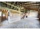 Large barn interior featuring wooden beams and a hay loft at 2009 W 250 N, Lebanon, IN 46052