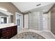 Bathroom with double vanity, glass block shower, and a doorway into a closet at 2009 W 250 N, Lebanon, IN 46052