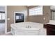 Corner bathtub with tile floors and walls at 2009 W 250 N, Lebanon, IN 46052