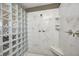 Updated shower features marble pattern wall, glass block accent and built in seat at 2009 W 250 N, Lebanon, IN 46052