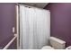 Full bathroom includes a toilet and tub shower combo with a geometric patterned curtain at 2009 W 250 N, Lebanon, IN 46052
