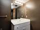 Bathroom with a white sink, a mirror, and hardware with a bronze finish at 2009 W 250 N, Lebanon, IN 46052