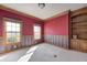A charming bedroom features classic woodwork, a built-in bookcase, and two bright windows at 2009 W 250 N, Lebanon, IN 46052