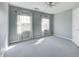 Bedroom includes large windows with scenic views, neutral carpet, and a ceiling fan at 2009 W 250 N, Lebanon, IN 46052