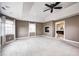 Large bedroom with windows, a fireplace, a ceiling fan and neutral carpet at 2009 W 250 N, Lebanon, IN 46052