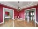 A formal dining room offers hardwood floors and views into multiple living areas at 2009 W 250 N, Lebanon, IN 46052