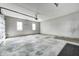 Spacious two-car garage with a gray concrete floor and a white garage door at 2009 W 250 N, Lebanon, IN 46052