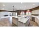Modern kitchen with a large island, bar seating, updated appliances, and an attached living space at 2009 W 250 N, Lebanon, IN 46052