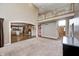 Spacious living room featuring a view to the kitchen, foyer, staircase, and upper landing at 2009 W 250 N, Lebanon, IN 46052