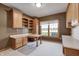The bright office boasts custom woodwork, built-in storage, and a large window at 2009 W 250 N, Lebanon, IN 46052
