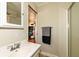 Bathroom with a single sink vanity, modern faucet, wall mirror and a towel bar at 202 Rainbow Blvd, Indianapolis, IN 46234