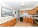Practical kitchen design featuring a breakfast bar, functional layout, and efficient appliances at 202 Rainbow Blvd, Indianapolis, IN 46234