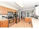 Modern kitchen with stainless steel appliances, wood cabinets, and easy access to the rest of the home at 202 Rainbow Blvd, Indianapolis, IN 46234