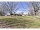 Expansive yard with mature trees offering shade and natural beauty at 202 Rainbow Blvd, Indianapolis, IN 46234