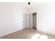 Bright bedroom with hardwood floors, white walls, and a closet at 2051 Columbia Ave, Indianapolis, IN 46202