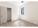 Bright bedroom features wood-look floors and a closet at 2051 Columbia Ave, Indianapolis, IN 46202