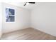 Bedroom with wood-look floors and large window at 2051 Columbia Ave, Indianapolis, IN 46202