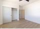 Bright bedroom with wood-look floors, closet, and neutral paint, creating a serene space at 2051 Columbia Ave, Indianapolis, IN 46202