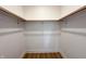 Walk-in closet featuring two wooden rods and white trim work at 2051 Columbia Ave, Indianapolis, IN 46202