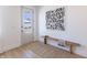 Bright entryway with a wooden bench and black and white art that adds modern flare at 2051 Columbia Ave, Indianapolis, IN 46202