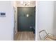 Welcoming entryway featuring custom board and batten with hooks and a bench at 2051 Columbia Ave, Indianapolis, IN 46202