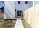 Backyard patio with sliding glass doors and a privacy fence at 2051 Columbia Ave, Indianapolis, IN 46202