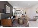 Open floor plan with a modern living room leading to a bright kitchen with an island at 2051 Columbia Ave, Indianapolis, IN 46202