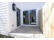 Private patio with sliding glass door and new wooden fence at 2051 Columbia Ave, Indianapolis, IN 46202