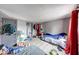 Spacious bedroom with grey walls, wood-look floors and ample closet space at 215 S Warman Ave, Indianapolis, IN 46222
