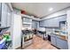 Compact kitchen featuring basic appliances and utilitarian countertops at 215 S Warman Ave, Indianapolis, IN 46222