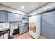 Modest kitchen with essential appliances and simple cabinetry at 215 S Warman Ave, Indianapolis, IN 46222