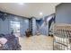 Living room showcasing built-in shelves, staircase, and a view into the kitchen at 215 S Warman Ave, Indianapolis, IN 46222