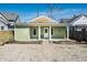 Charming home featuring a welcoming front porch, gravel yard, and minimalist landscaping at 2361 Southeastern Ave, Indianapolis, IN 46201
