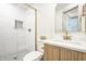Bright bathroom features a glass-enclosed shower, modern vanity, and stylish fixtures at 2361 Southeastern Ave, Indianapolis, IN 46201