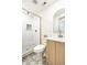 Elegant bathroom showcases a glass-enclosed shower and a stylish vanity with gold fixtures at 2361 Southeastern Ave, Indianapolis, IN 46201
