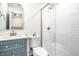 Bright bathroom featuring modern fixtures, glass shower and beautiful vanity at 2361 Southeastern Ave, Indianapolis, IN 46201