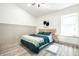 Comfortable bedroom with vaulted ceiling, window, and stylish decor at 2361 Southeastern Ave, Indianapolis, IN 46201