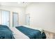 Bedroom with a large bed, light wood floor, and a minimalist design at 2361 Southeastern Ave, Indianapolis, IN 46201