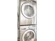 The modern laundry area features a sleek, stacked washer and dryer unit at 2361 Southeastern Ave, Indianapolis, IN 46201