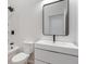 Modern bathroom features sleek black fixtures, vanity and large mirror at 2362 English Ave, Indianapolis, IN 46201
