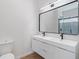 Elegant bathroom with double sink vanity, modern fixtures, and large mirror at 2362 English Ave, Indianapolis, IN 46201
